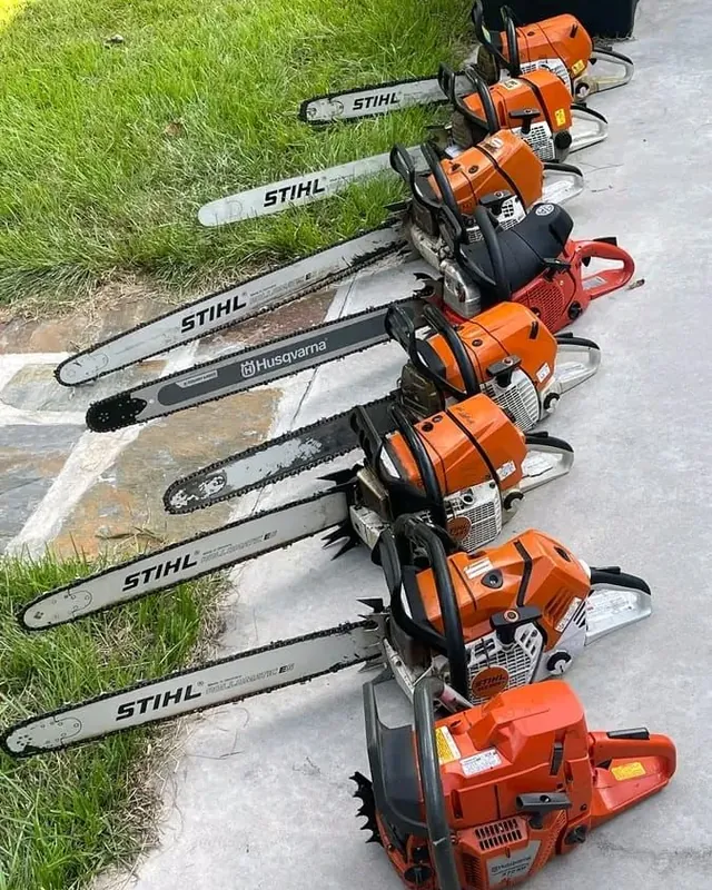 Tree Guy's Stihl and Husqvarna chainsaws in a row